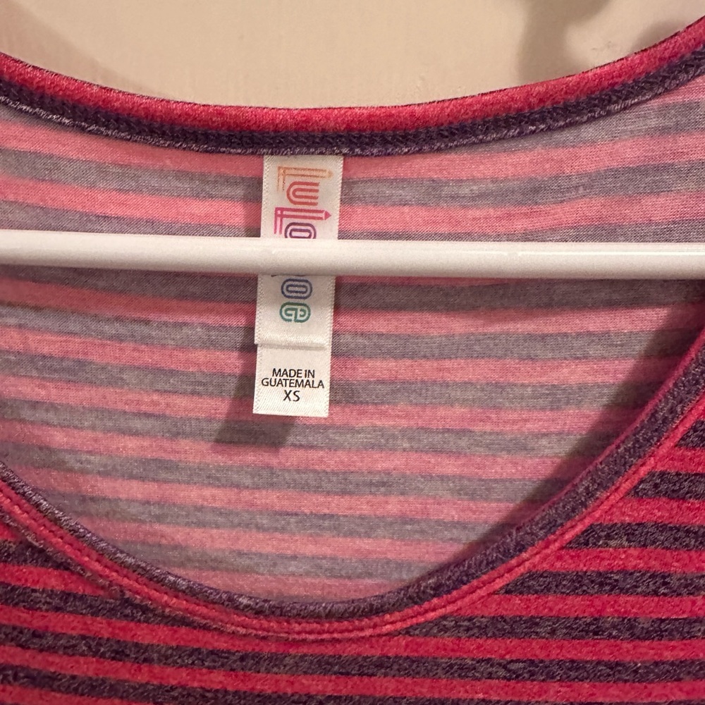 LulaRoe PerfectT size XS pink with purple stripe.